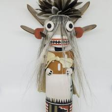 Carved from cottonwood root  painted with natural earth pigment paints. Other materials used  duck  quail feathers and horse hair.