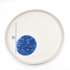 White tray decorated with blue persian writing.