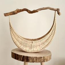 U-shaped basket with white weave and dark driftwood handle