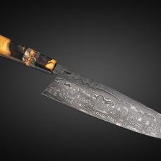 My eight in chef  the Damascus is diffusion bonded by me from 26C3 and 15N20 steels. The handle is made from Smoky Mountains Poplar with dyed maple burl accents