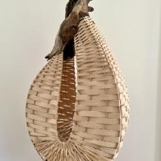 teardrop shaped basket with white weave and dark driftwood rim