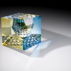 Optical glass that has been cold-worked: a centuries old Bohemian technique using no heat  but rather room temperature glass is shaped using water and abrasives in conjunction with lapidary tools. The techniques involved are cutting  grinding  polishing  laminating and coloring.