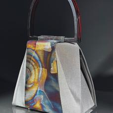 Evening handbag made of stainless steel mesh  decorated with the illusion foil. Adjustable handle made of aircraft cable
