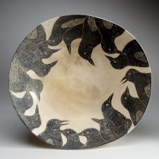 bowl depicting many birds around rim