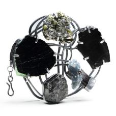 one of a kind Brooch/Pendant sterling silver  rough tourmaline  steel Minerals are set on a platform that is a reconfigured handmade chain