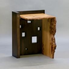 The Oriel IV side table features a blackened solid walnut base which has been perforated with square &amp;quot;windows&amp;quot; of various sizes creating a sculptural play of light and shadow. The live edge cantilevered top and waterfall joined leg in highly figured elm complete the structure.