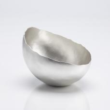 This piece was created from hammering a flat silver sheet up into a three dimensional form and was sanding to a silky satin finish.