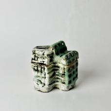 Hand-built stoneware and porcelain kurinuki-carved box  with slips and glazes.