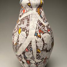 Ceramic vase with bold black and white illustrations of human figures and accented with occassional bright colors