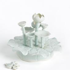 porcelain lily pad with lotus flowers and a frog.