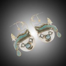 18k Gold Filled metal framed interwoven with Glass Seed Beads. Set with Turquoise.