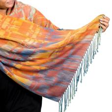 Handwoven shawl  hand painted warp and hand dyed tencel a sustainable yarn from Eucalyptus trees. Woven in original pattern on a floor loom. Colors and pattern pay homage to the Blue Earred Kingfisher with vibrant oranges blues and teal.