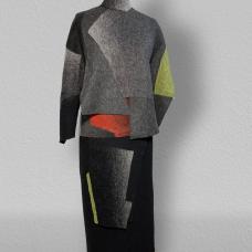 The process involved in making this ensemble begins with knitting and dying the fabric . Afterwards the pieces of fabric are cut to different shapes. The key to the work resides in felting ; the different cuts of fabric are refelted together creating a gradation of grays  black and green .