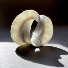 Porcelain sculpture. It has a unglazed surface.