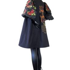 A-line short coat constructed with mill end fabrics. Custom embroidery incorporates an authentic Palestinian pattern and a poem by Hiba Abu Nada (1991-2023).