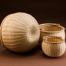 Nest of three swing handle baskets.