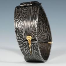 House made Damascus steel with 18K gold formed into a cuff