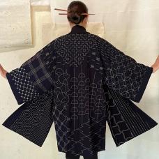 Each time I create this piece  I take my feelings of the moment to generate originality. Each pattern meets another in an asymmetrical way  creating an exciting puzzle for the eye. The fabric was dipped 60 times in natural indigo plant dye  with thread dyed from chestnut  onion  and other plants.