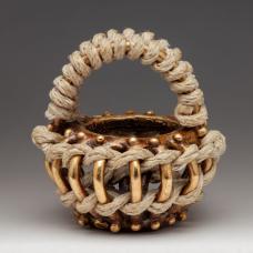 Cast basket with woven and twined hemp