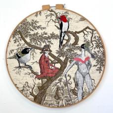 embroidered bird people and birds on  vintage toile decor fabric.