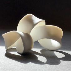 Porcelain twisting mobius piece. It has a unglazed surface.