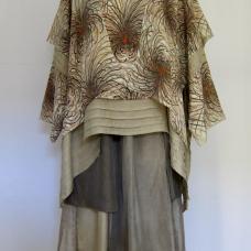 This pullover is made from 100% Monkinsha silk (no longer produced). The lining is dyed with rose natural dyes  and is also part of the design. The skirt is made from 100% silk fabric from different regions  dyed with rose natural dyes. The silk fabrics from different regions are each dyed a diffe