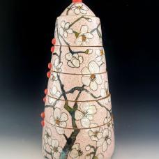 Jar made with a combination of hand-building and wheel-throwing techniques with painterly glaze and under glaze decoration of spring blossoms.