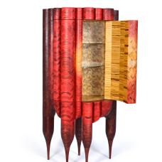 red rounded cabinet with door open