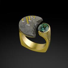 Crescent Ring in Gibeon Meteorite and 18k gold  with diamonds and a 2.17 ct Brazilian Tourmaline. Fabricated  cast  carved  inlayed  and etched.