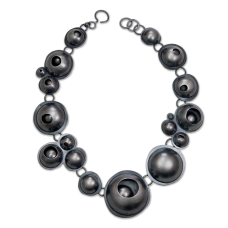 metal necklace with bubble shaped forms