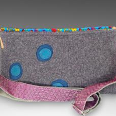 purse with three circles and a purple strap