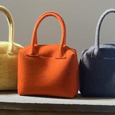 a row of colorful felt bags