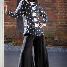 model with black and white shirt accented with squares